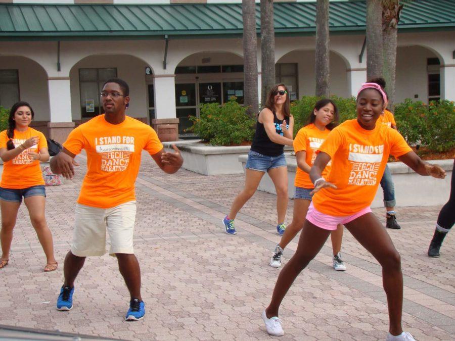 Dance Marathon mob flashes Student Plaza