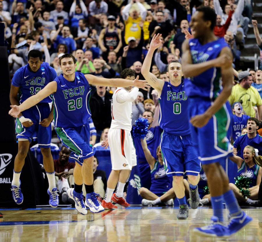 Florida Gulf Coast's Eric McKnight, from left, Chase Fieler, Brett Comer and Bernard Thompson celebrate after a dunk by McKnight late the second half of a third-round game against San Diego State in the NCAA college basketball tournament, Sunday, March 24, 2013, in Philadelphia. Florida Gulf Coast won 81-71. (AP Photo/Matt Slocum)