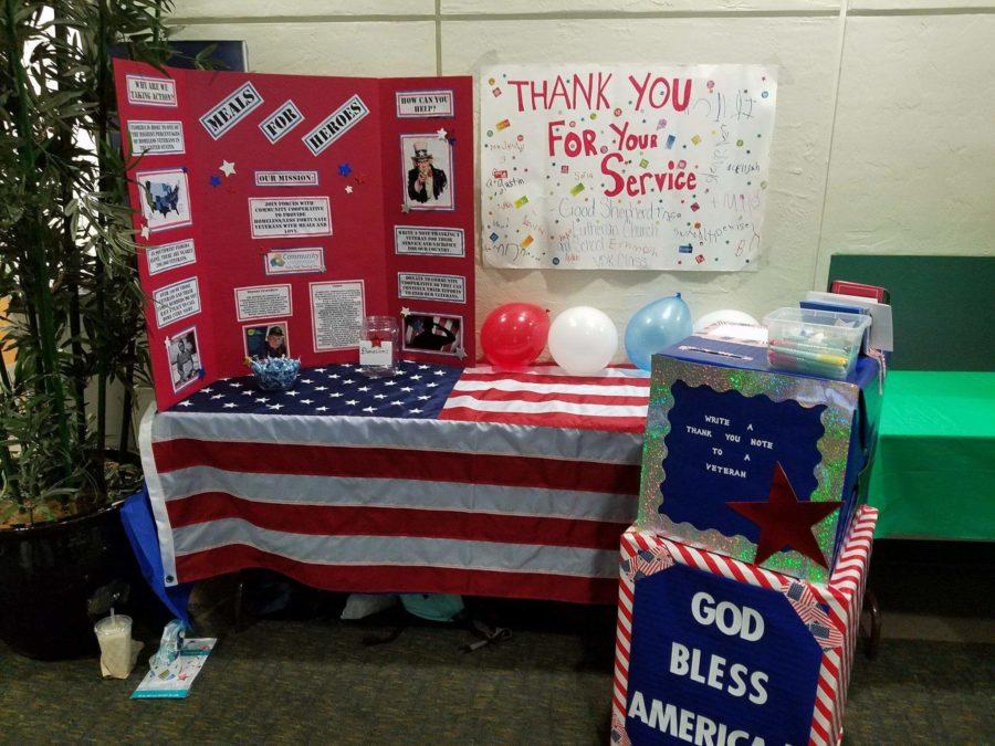 Juan Monter and his service learning group’s Family Expo set up included boxes where people can submit their letters for homeless veterans. (Photo courtesy of Juan Monter)
