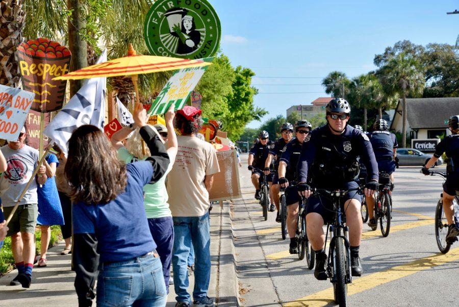 Tampa police monitor Return to Human Rights Tour marchers. (EN Photo / Rachel Iacovone)