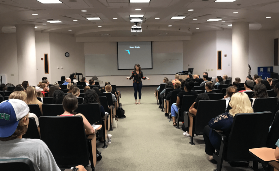 FGCU alumna, Bonny Shade, addresses a crowd in Edwards Hall room 112 during her lecture titled “Just Another Assault.” (EN Photo / Taylor Crehan)