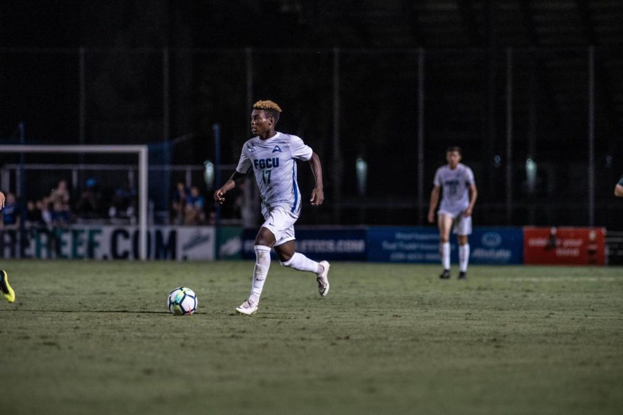 EN+Photo+by+Bret+Munson+%2F%2F+Shak+Adams+dribbles+the+ball+during+a+game+against+USF.+Adams+had+three+goals+against+the+Bulls%2C+and+took+home+ASUN+Player+of+the+Week+Awards.