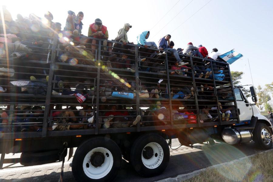 Central+American+migrants%2C+part+of+the+caravan+hoping+to+reach+the+U.S.+border%2C+get+a+ride+on+a+truck%2C+in+Celaya%2C+Mexico%2C+Sunday%2C+Nov.+11%2C+2018.+Local+Mexican+officials+were+once+again+Sunday+helping+thousands+of+Central+American+migrants+find+rides+on+the+next+leg+of+their+journey+toward+the+U.S.+border.+%28AP+Photo%2FMarco+Ugarte%29