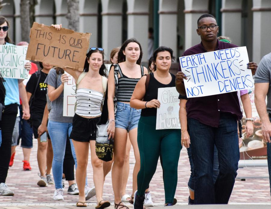 EN Photo by Raphaella Matta. Marchers at the climate change rally at FGCU. 
