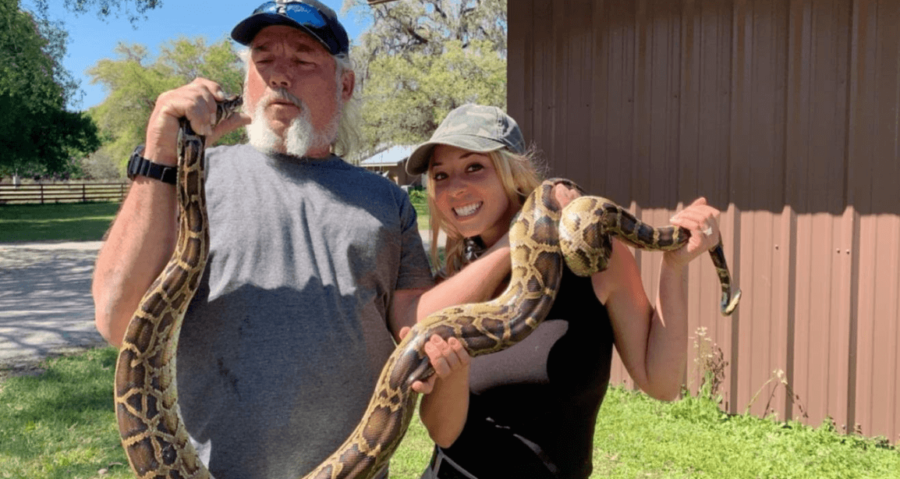 Photo provided by Brittany Borges. Dusty The Wildman Crum and Brittany Borges holding a python. The two star on the Discovery Channel series, Guardians of the Glades. 