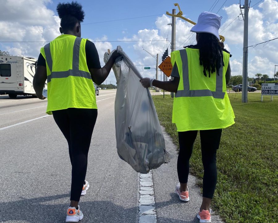 SISTUHS collect litter during their road clean up service event on Sept. 25.
Photo courtesy of Syncere Seneque. 