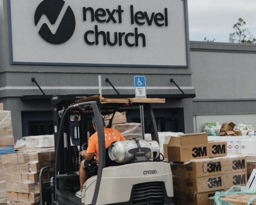 Boxes of supplies are stacked outside of Next Level Church to aid families after Hurricane Ian. Photo courtesy of Next Level Church