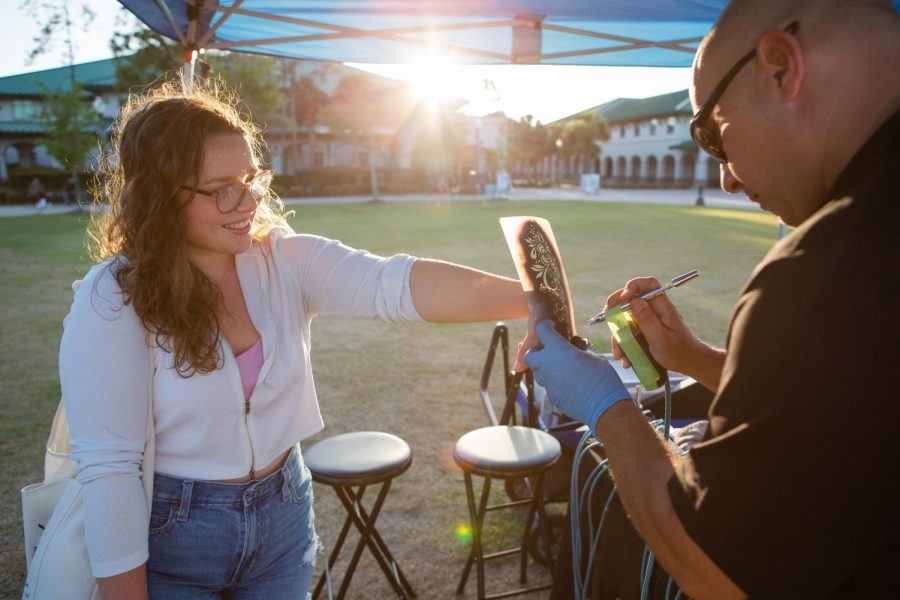 The annual Eagle Radio Music Festival included activities such as airbrush tattoos, caricature drawings, and food trucks for students in attendance on Thursday March 23, 2023. 