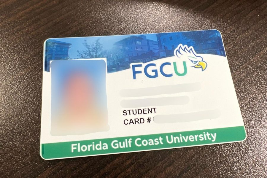 The new ID card sport FGCUs new logo. Image and information is blurred to preserve student information.
