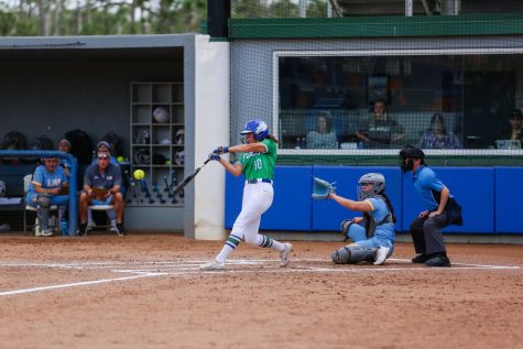 Tayli Filla swings at a ball during the Feb. 11 matchup against LIU. The Eagles won 5-3.