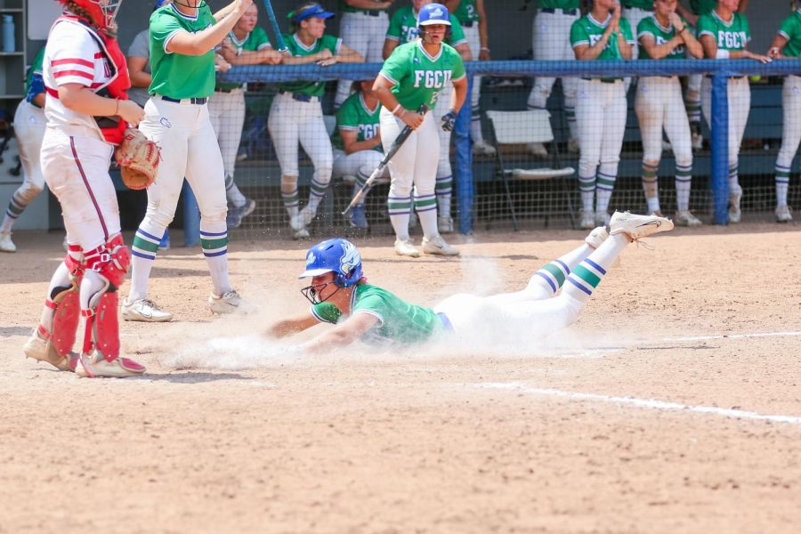 Tiffany Meek (17) slides into home plate on Sundays game against Austin Peay. The Eagle won Sundays game 5-4 which lead them to the series win. 