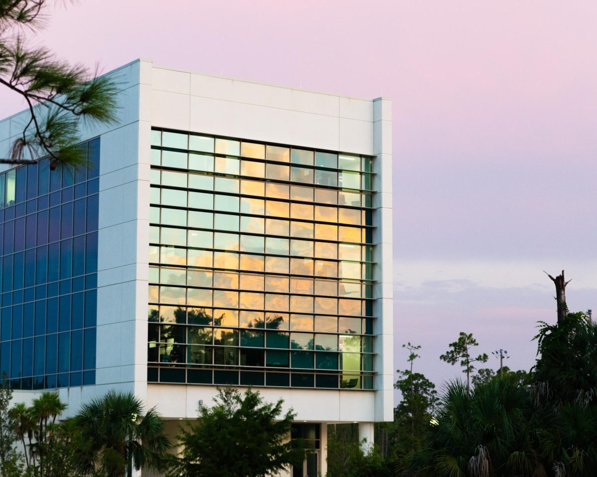 The sunset reflects on to the windows of the Water School. Photo by Adrian Roper. 