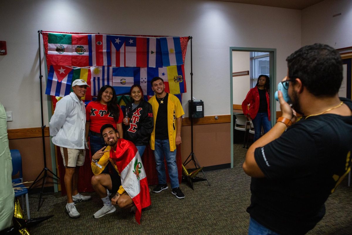 Students gather for a photo as they celebrate their heritage during the 2022 Noche de Culture celebration. 