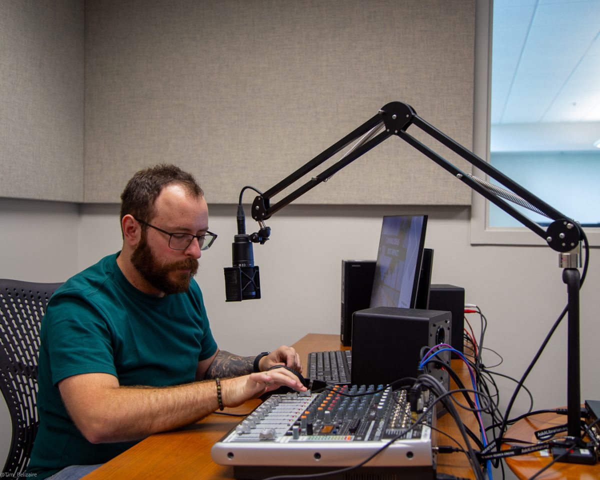 Creative Commons Lab Coordinator Matt Losey using the equipment in the new audio studio.