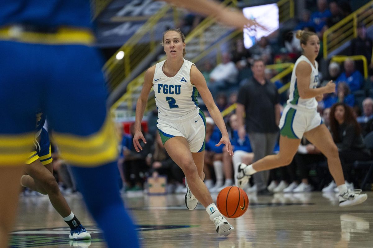 Sofia Persson (2) dribbles the ball up the court in the first round of the Gulfcoast Showcase against the University of Delaware on Friday, November 24, 2023. Photo by 