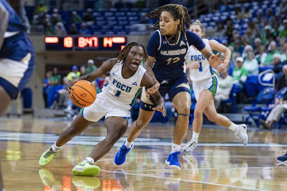 Emani Jefferson (#1) drives to the basket against Queens during Thursday nights game at Alico Arena on January 18, 2024. Jefferson broke a career-high point record with 24 points during the game. Photo by 