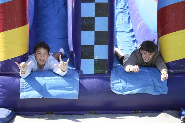 FGCU students celebrate the 2024 Homecoming Week by enjoying the inflatable slide on the library lawn on Wednesday, Feb 7, 2024. Photo by Lexi Harbach 
