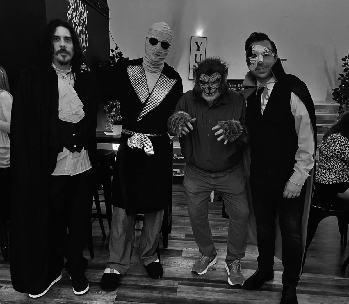 Left to right: Steven Donaldson, Dr. Eric Otto, Professor Michael Kennedy, and Professor Michael Mancini pose for a picture at their Halloween show at Chocolattés. 